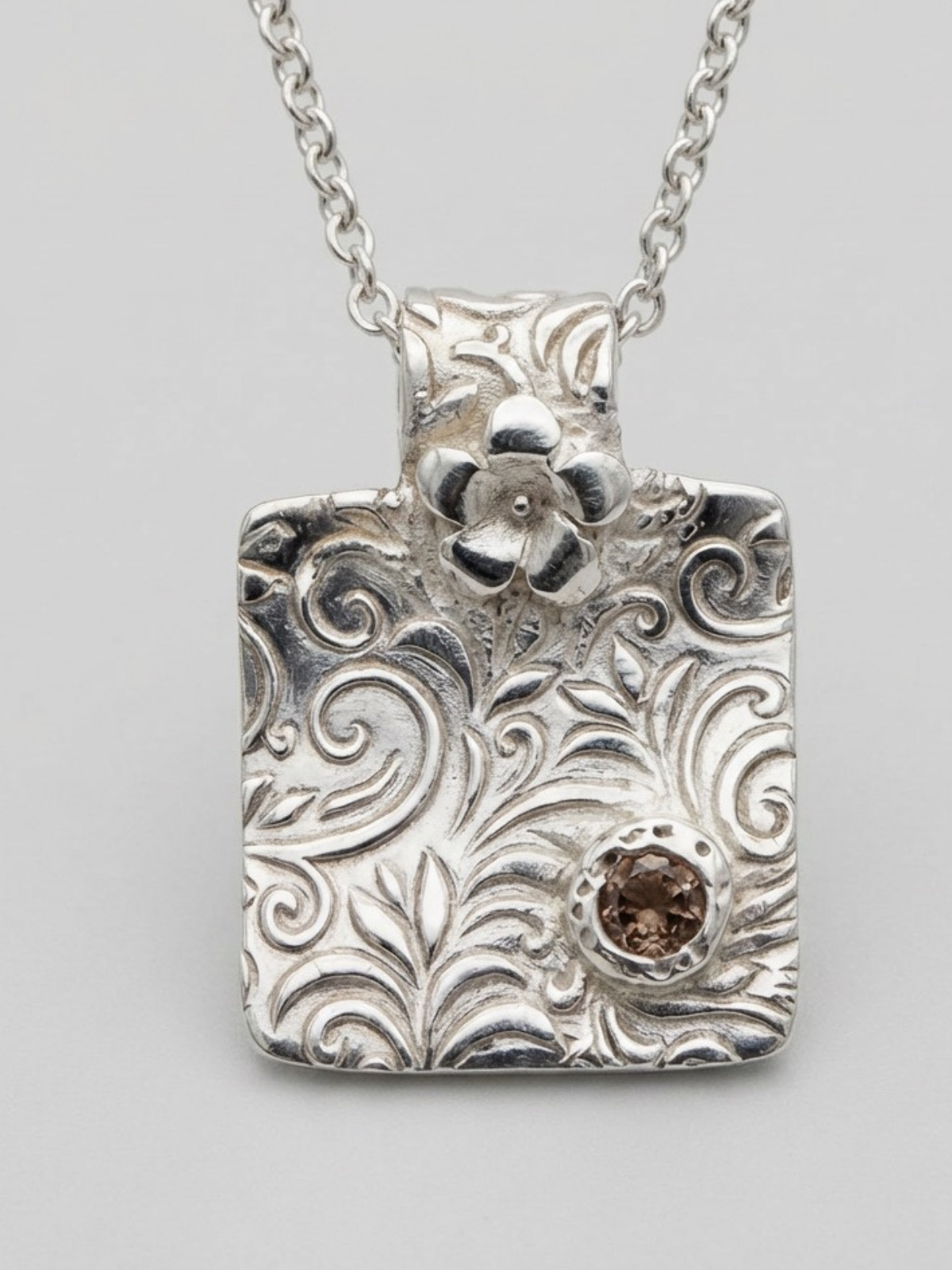 fine_silver_textured_pendant_with_pink_cubic_zirconia