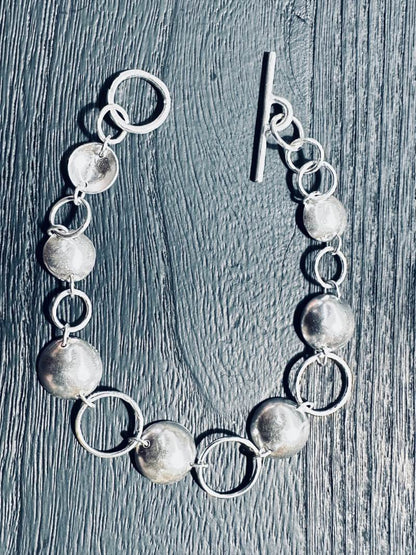 sterling_silver_bracelet_with_circle_and_disc_details